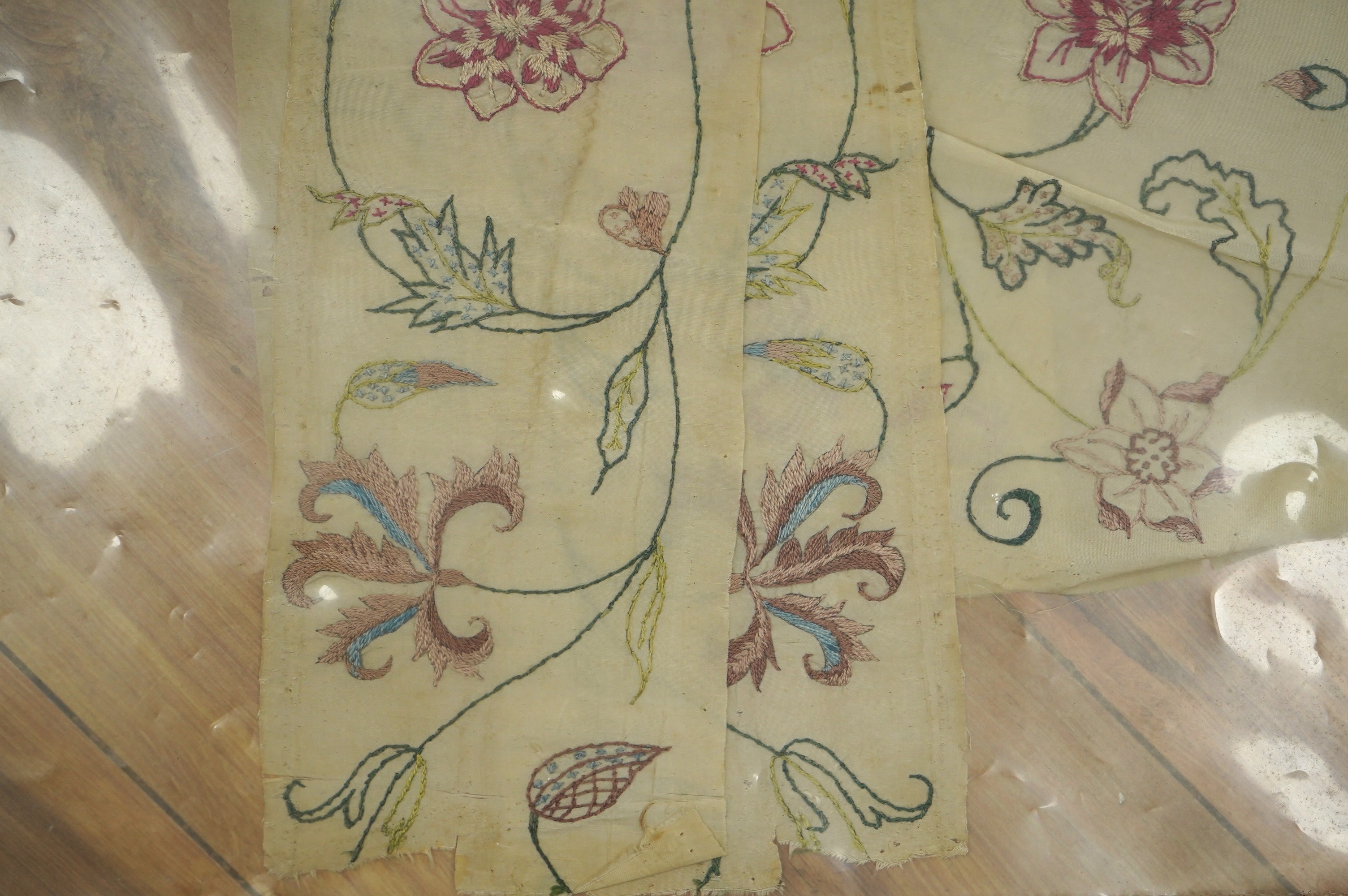 Two pairs of 18th century embroidered silk dress panels, one pair sleeve panels, the other pair possibly bodice panels, all panels hand embroidered in multi-coloured silk threads into a floral vineous design, sleeve pane